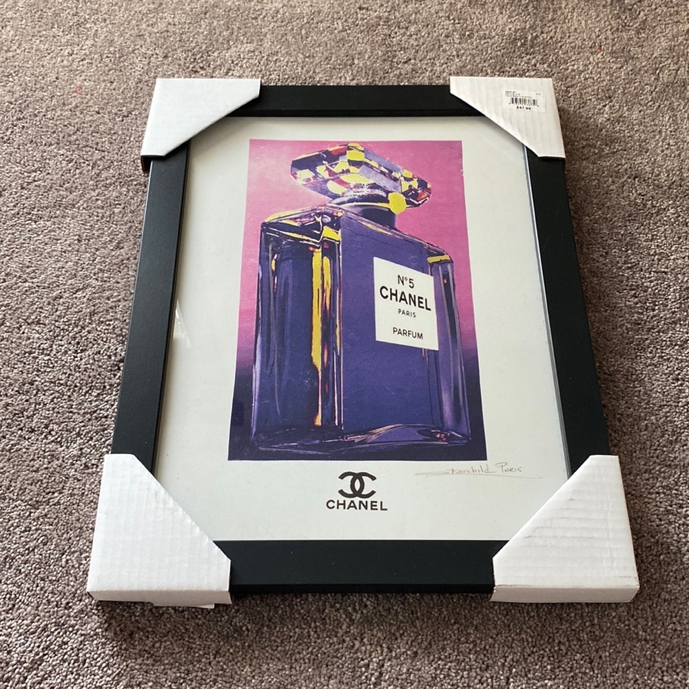 Fairchild Paris Chanel Bottle Framed Print